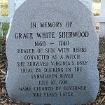 A vertical stone marker with Grace Sherwood information